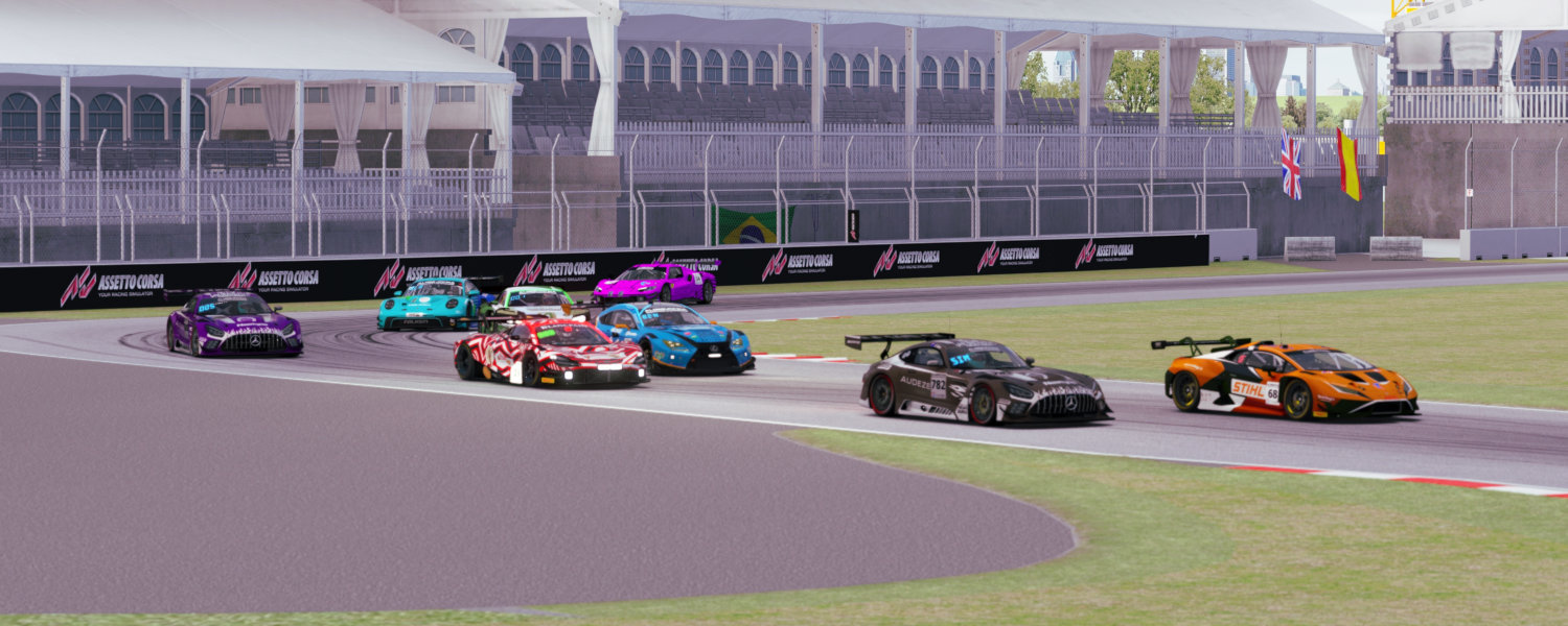 A group of cars racing closely on a track, showcasing speed and competition among the drivers.